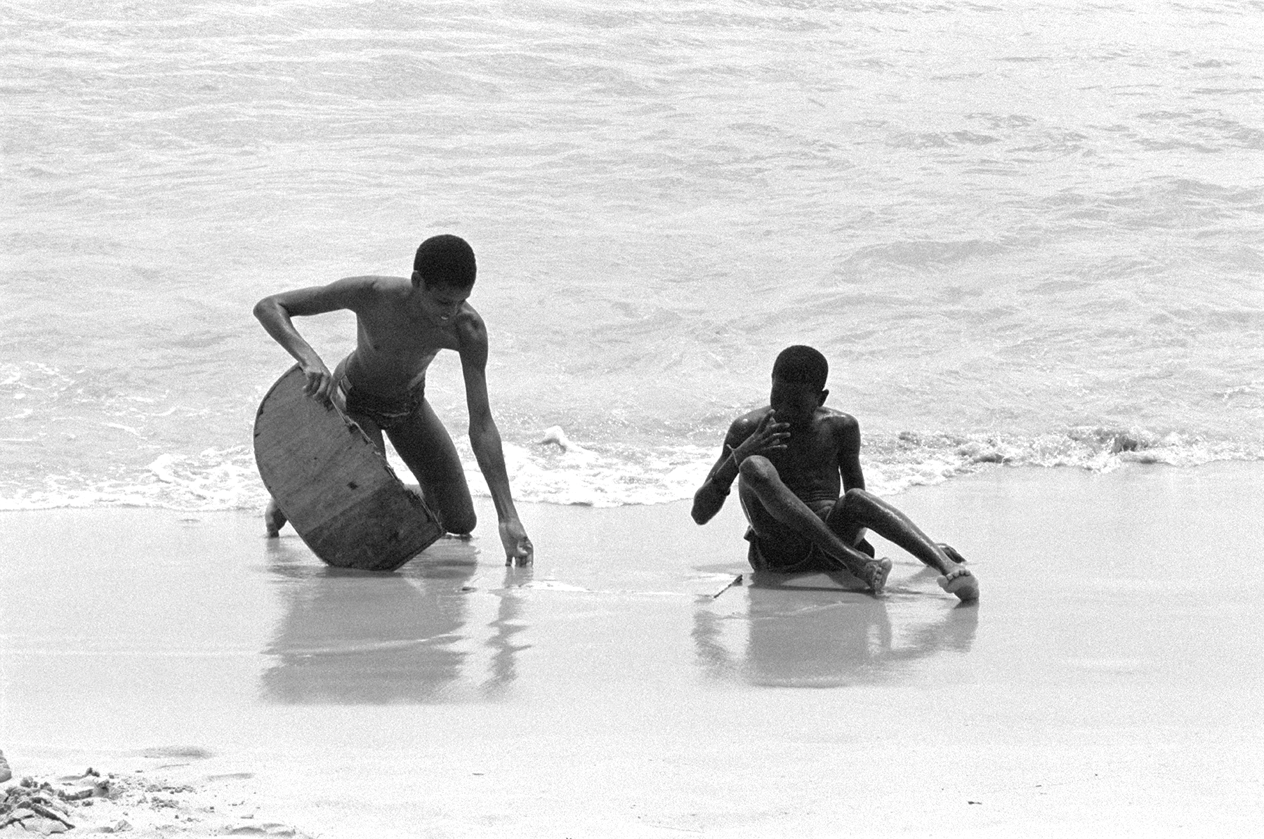 Photos by Francesca Phillips of boys playing on the beach in Barbados